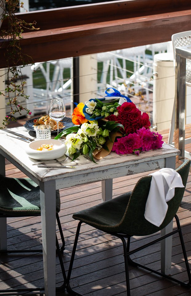 Deck tables dressed above the water