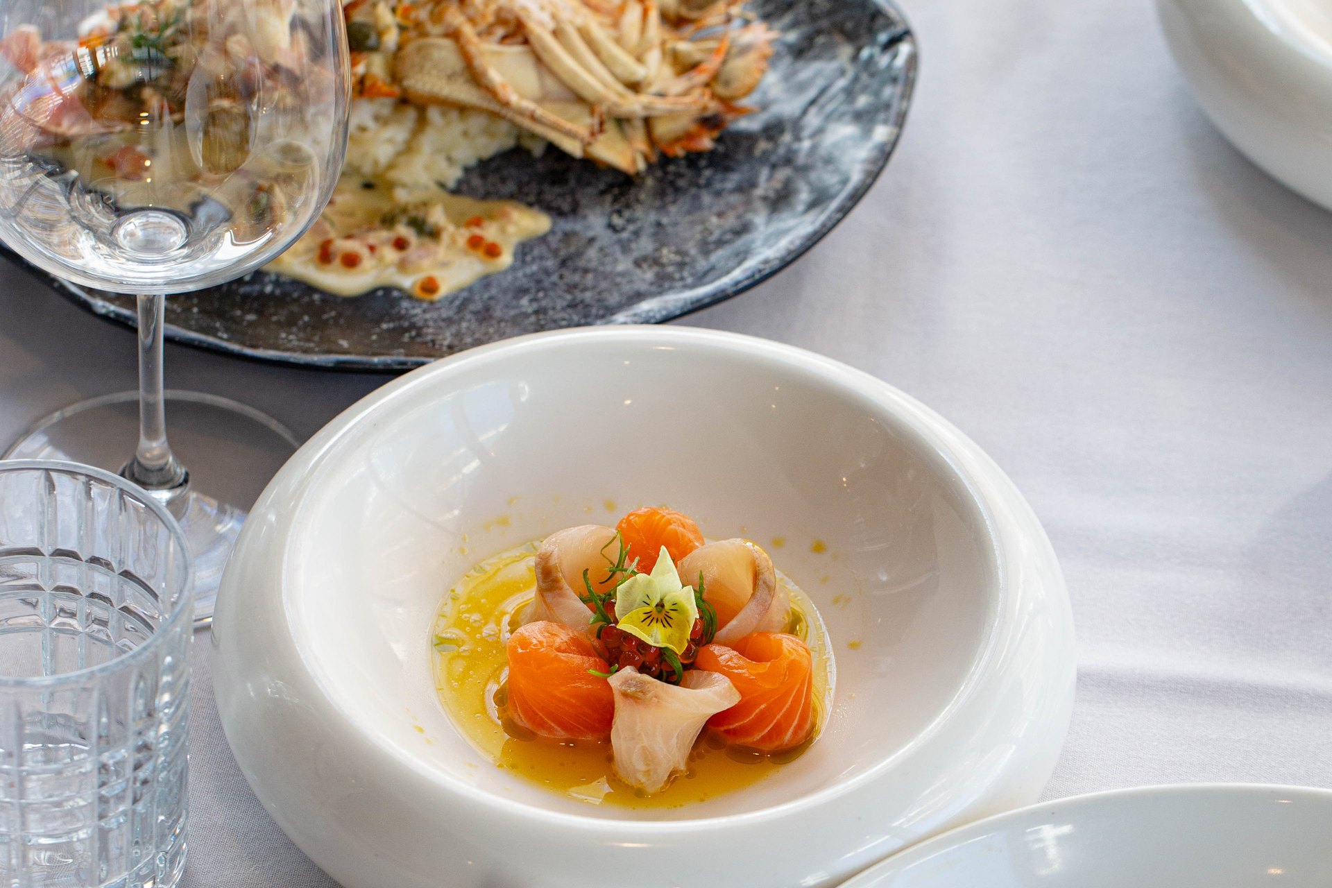 A spread of Moreton Bay bug and crudo across the table
