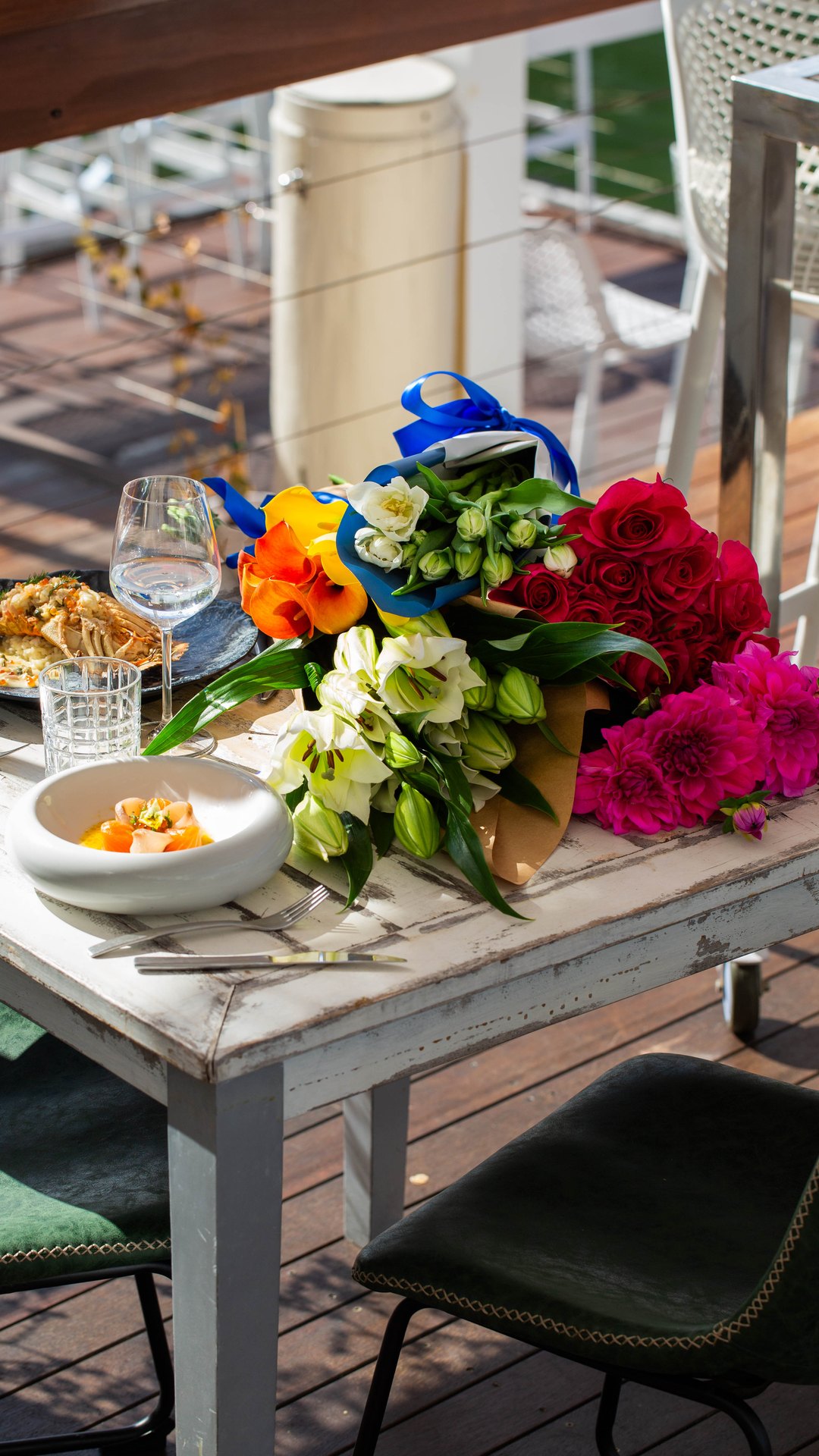 A long table dressed with flowers for a private function
